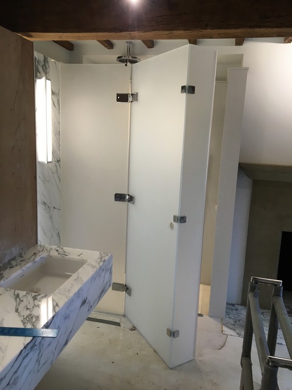 Bespoke frosted glass shower enclosure in Stamford Hill luxury bathroom
